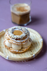 Close-Up of Pistachio and Pumpkin Christmas Paris-Brest Dessert with Pumpkin Latte
