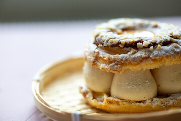 Close-Up of Pistachio and Pumpkin Christmas Paris-Brest Dessert
