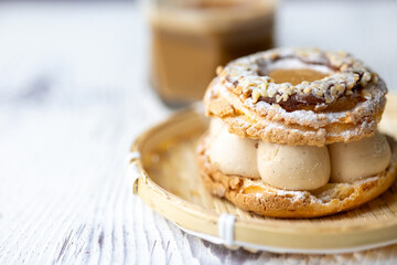 Close-Up of Pistachio and Pumpkin Christmas Paris-Brest Dessert with Pumpkin Latte

