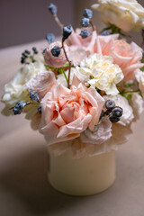 Spring bouquet of mixed flowers on vintage gray wall background behind