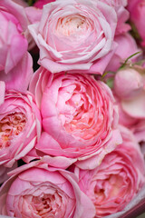 Spring bouquet of mixed flowers on vintage gray wall background behind