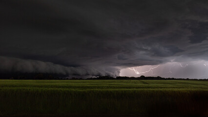 Dark Storm Clouds with Lightning Over Field © Jerome