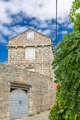 Charming Stone Village Street With Cobblestone Path And Ivy Covered Walls In Sunlit Gornje Selo, Solta