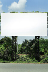 india. billboard on city road, outdoor advertising, mockup billing board in front of green tree and Blank white background for branding design large hoarding, Outdoor advertising construction