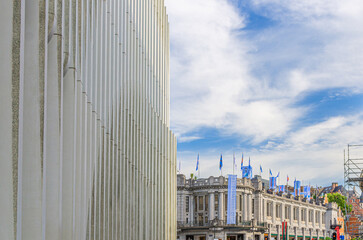 Street view in Brussels city historical center with Centre for Fine Arts Palais des Beaux-Arts BOZAR art building and structure wall of Montagne du Parc Contemporary office BNP Paribas Fortis bank