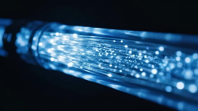 Fiber optic cable with glowing blue light transmission. Speed internet network technology, digital data communication infrastructure, and modern telecommunications connectivity. Abstract tech