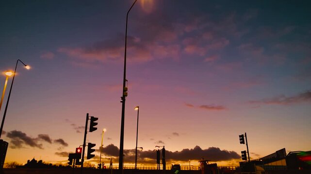 Urban Sunset Over City Street, Streetlights, Traffic Lights Silhouetted, Colourful Sky, Holland Park Avenue, A3220 Road, London, UK
