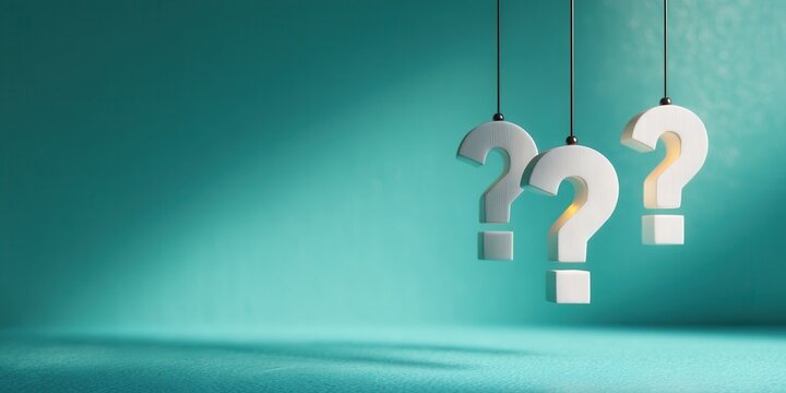 Question Marks Hanging Against a Teal Background Showing Uncertainty and Confusion
