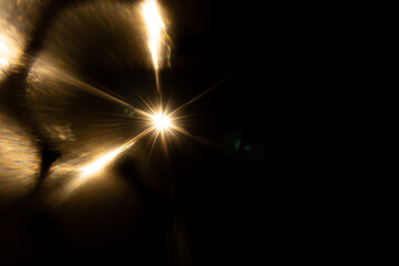 Lens Flare. Light over black background. Easy to add overlay or screen filter over photos. Abstract...
