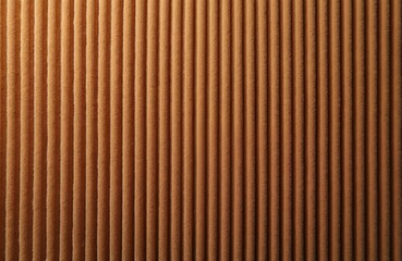 Obraz premium Close-up view of ribbed corduroy fabric in warm brown hue. Vertical wales create a textured surface, offering a tactile feel for apparel or interior design elements. This plush textile adds depth.