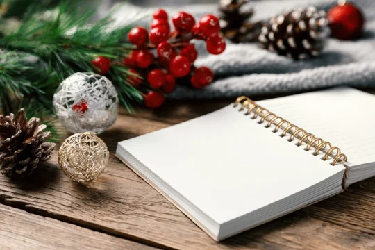 Wooden desk with holiday calendar and cozy festive details