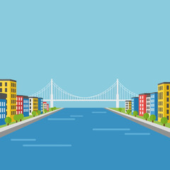 Cityscape with bridge over water, buildings on both sides.
