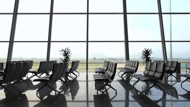 Deserted airport terminal with empty chairs and large windows overlooking the runway, reflecting the quiet and lonely atmosphere of a modern transportation hub without any passengers