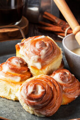 Cinnabons, cinnamon rolls topped with a cream of cream, cheese and sugar.