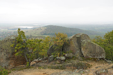 Mountain landscape panorama cliffs stones forest Balkans autumn cloudy day nature