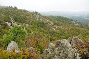 Mountain landscape panorama cliffs stones forest Balkans autumn cloudy day nature