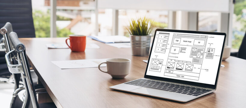 Laptop computer with opened lid on table in meeting room of office workspace. - Powered by Adobe