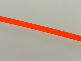 Vermilion diagonal line on broken white background, orange tone