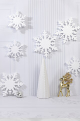 Christmas Eve concept. Christmas and New Year's mockup for product design and display featuring snowflakes, deer, and decorations on festive background. Holiday design template, greeting card.