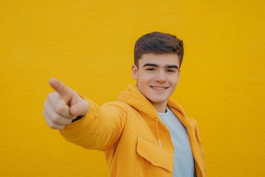 Confident teenager pointing directly at camera