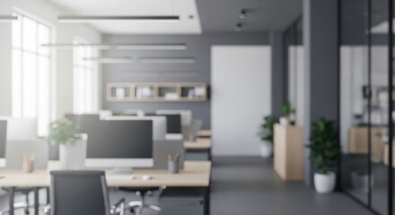 Blurred modern office interior with desks computers and bright windows