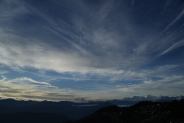 Darjeeling and the Kanchenjunga mountain range in the Himalayas visible behind it.