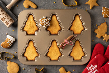 A baking scene features tree shaped cookies in a metal mold, star decorations, and festive trim. Cinnamon scent fills the air as holiday gifts and warm memories come to life