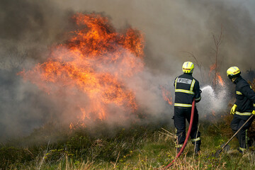 Wildfires fire burning with a lot of smoke, firefighters