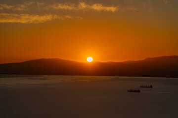 Fototapeta premium Greece, Peloponnese, Kalamata - 3 April 2024 - Spectacular and evocative sunset in Kalamata, Greece
