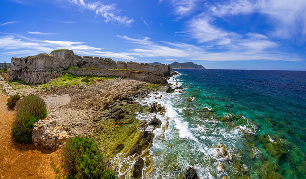 Greece, Peloponnese, Methoni - 4 April 2024 - Wonderful view of the Methoni fortress and the turquoise sea with the waves crashing on the coast