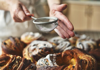 Hand Dusting Easter Cakes with Powder