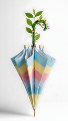 A striking vertical display combines vibrant umbrellas in shades of blue, pink, and yellow, adorned with lively plants, evoking a sense of fun and creativity
