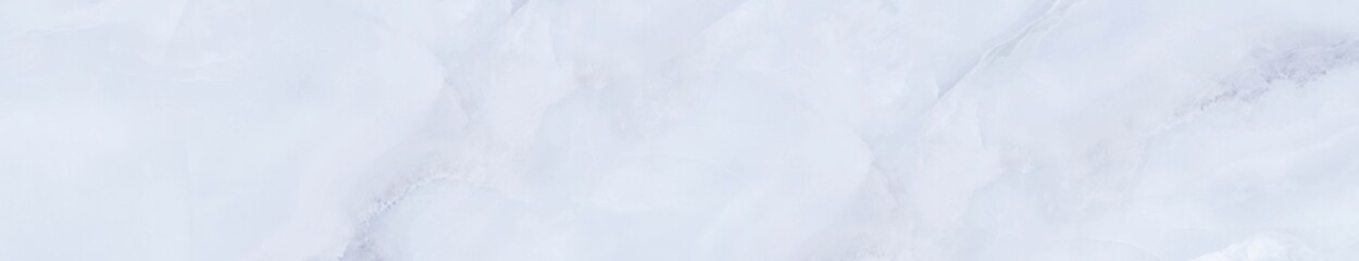 Pale blue marble texture with soft cloudy veins and smooth polished surface for elegant wall or interior design background