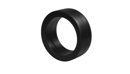 Black, donut-shaped object with a recessed center and raised edges stands against a black background
