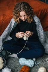 knitting session with colorful yarn, relaxed evening spent crafting with vibrant yarn balls