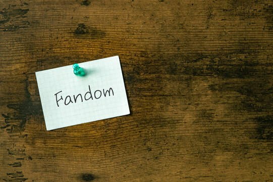 There is a piece of paper with the word Fandom. It is as an eye-catching image.