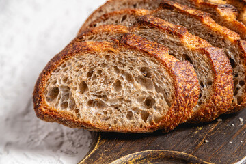 Close-up Detail of Sliced Sourdough Bread on Dark Cutting Board