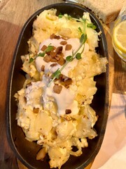 Hungarian túrós csusza dish with cottage cheese and bacon