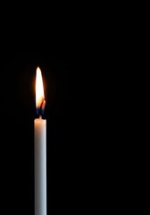 Single white slim burning candle flame glowing softly, offering stark contrast against a deep black background ,dark ,atmosphere ,ritual