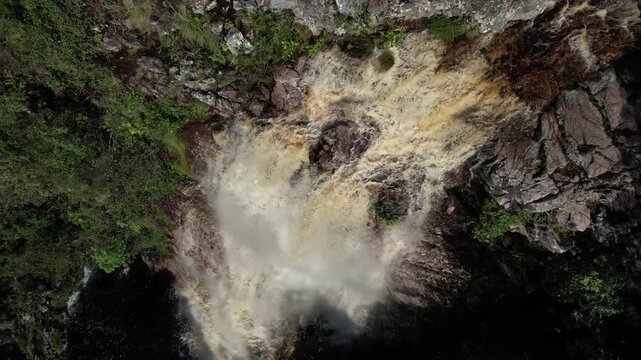 panoramic aerial view of waterfalls in Chapada dos Veadeiros, Vale do Macaco, waterfall, large river with incredible large waterfalls, sunny day, trees, crystal clear water, Brazilian landscape