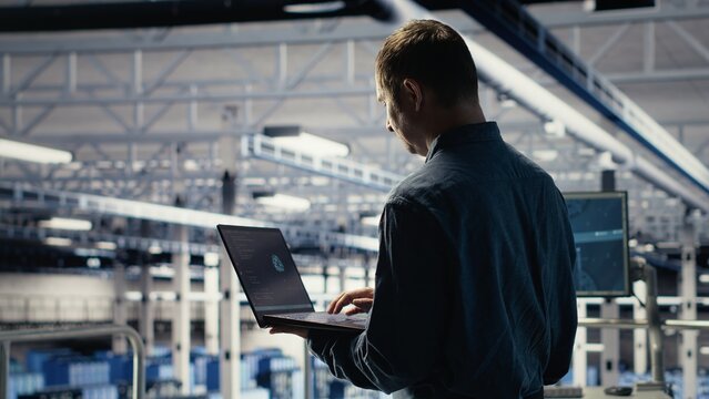 Data center engineer adjusts system settings to improve AI rigs processing speed and efficiency. Server hub employee manages infrastructure to support artificial intelligence workloads, camera B