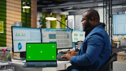 Professional manager works with graphs and isolated mockup screen, ensuring business success for...