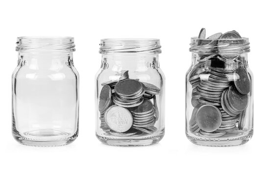 Set of money in glass jar isolated on white background.