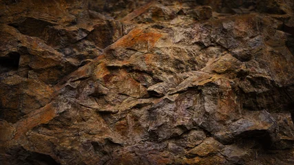 Black dark red orange brown rock texture with cracks. Close-up. Rough mountain surface. Stone granite background for design. Nature.  © Наталья Босяк
