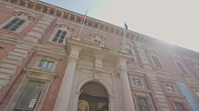 Facade of Pinacoteca di Brera with Italian and EU Flags, Milan,filmed on September 15, 2025.