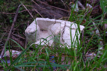 Obraz premium Macro of White Styrofoam Piece and Grass