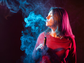 Woman in red sweater exhales thick vape smoke with colorful light effects, representing modern...