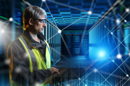 Data Center, Information Technology, Cybersecurity. Technician in safety vest and glasses works with laptop in server room with futuristic network and digital connections overlay. - Powered by Adobe