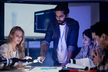 A startup team discusses future technology and innovation. They are planning a new AI robotics solution for digital transformation and sustainable ESG goals.