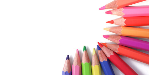 Many colorful pencils on white background